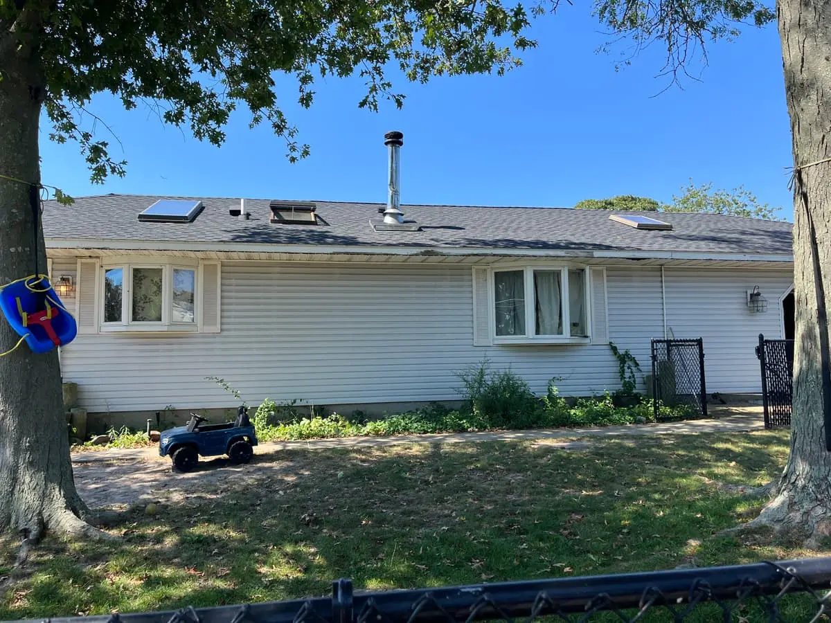 Selling without a realtor in Shirley: long vinyl ranch with skylights in the roof